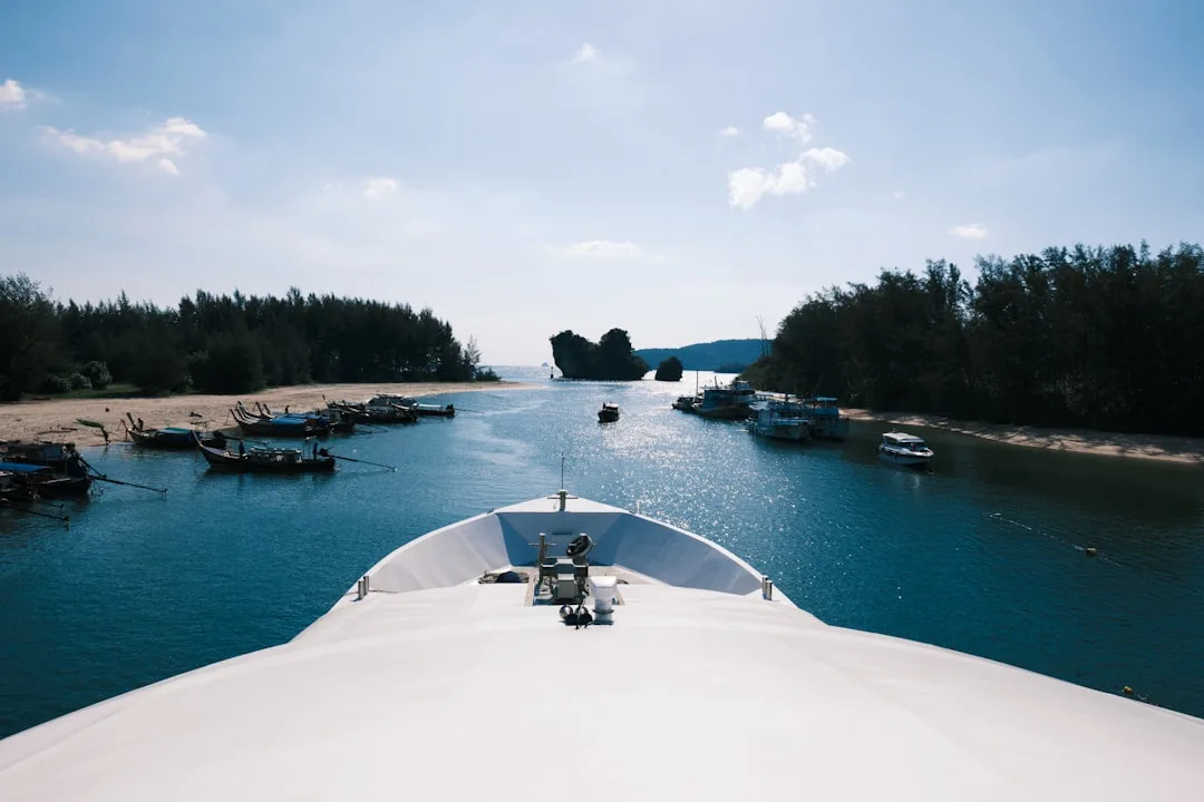 the view from the top of a ship looking down at the water